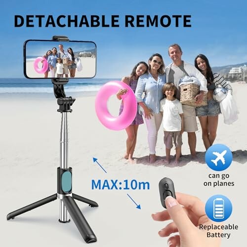 Family on beach using selfie stick with detachable remote.