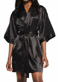 Woman wearing a black satin kimono robe.