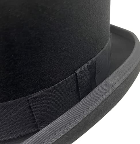 Close-up of a black top hat with ribbon detail