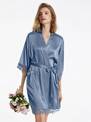 Woman in blue satin robe holding flowers