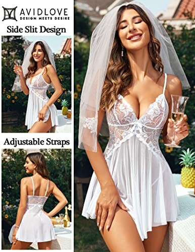 Woman in bridal lingerie with veil holding a glass of champagne