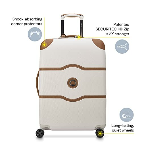 Durable suitcase with shock-absorbing corner protectors, strong patented zip, and quiet wheels.