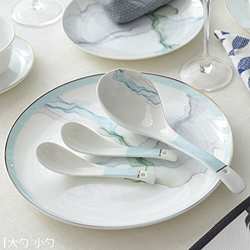 Elegant ceramic plate with decorative spoons on a table