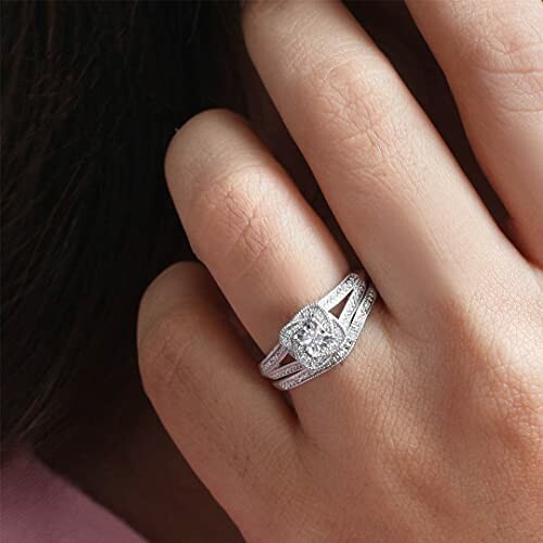 Close-up of a hand wearing a diamond ring