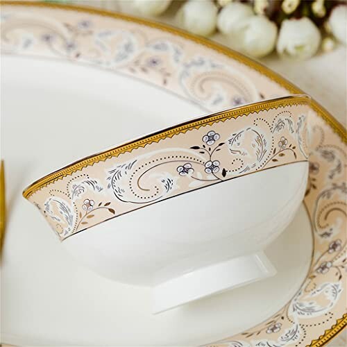 Elegant floral-patterned bowl with gold accents.