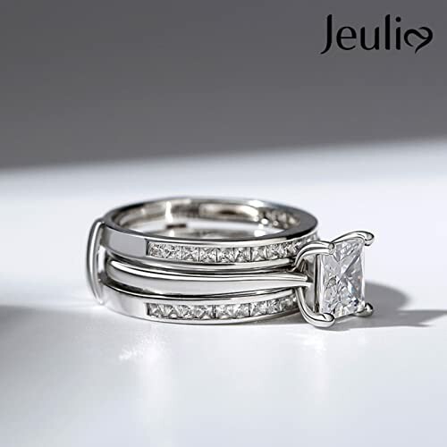 Elegant silver ring with a square-cut diamond.