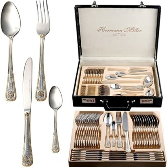 Elegant silverware set in a display case with various utensils.