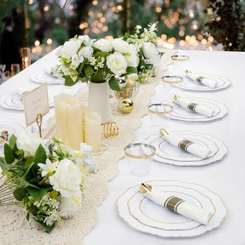 Elegant table setting with white flowers and candles.