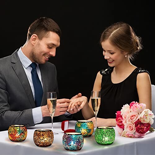 Couple at a candlelit dinner with a marriage proposal.