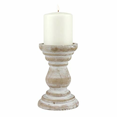 Rustic wooden candle holder with a lit white candle.