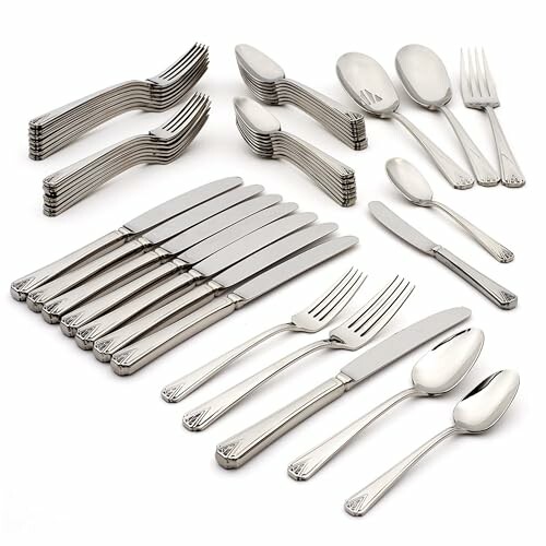 Stainless steel cutlery set with forks, knives, and spoons.