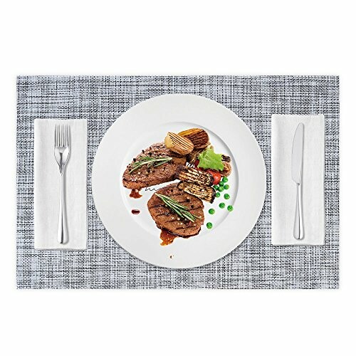 Steak with potatoes and peas on a plate with cutlery.