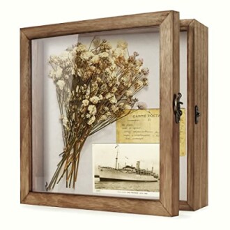 Shadow box with dried flowers and vintage postcard.