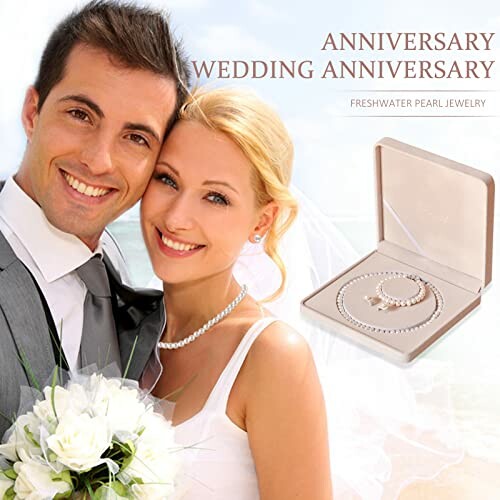 Smiling couple with wedding jewelry gift box.