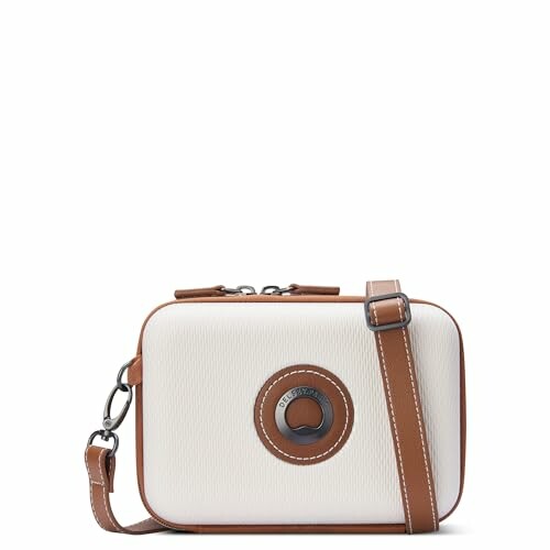 White and brown crossbody bag with circular emblem